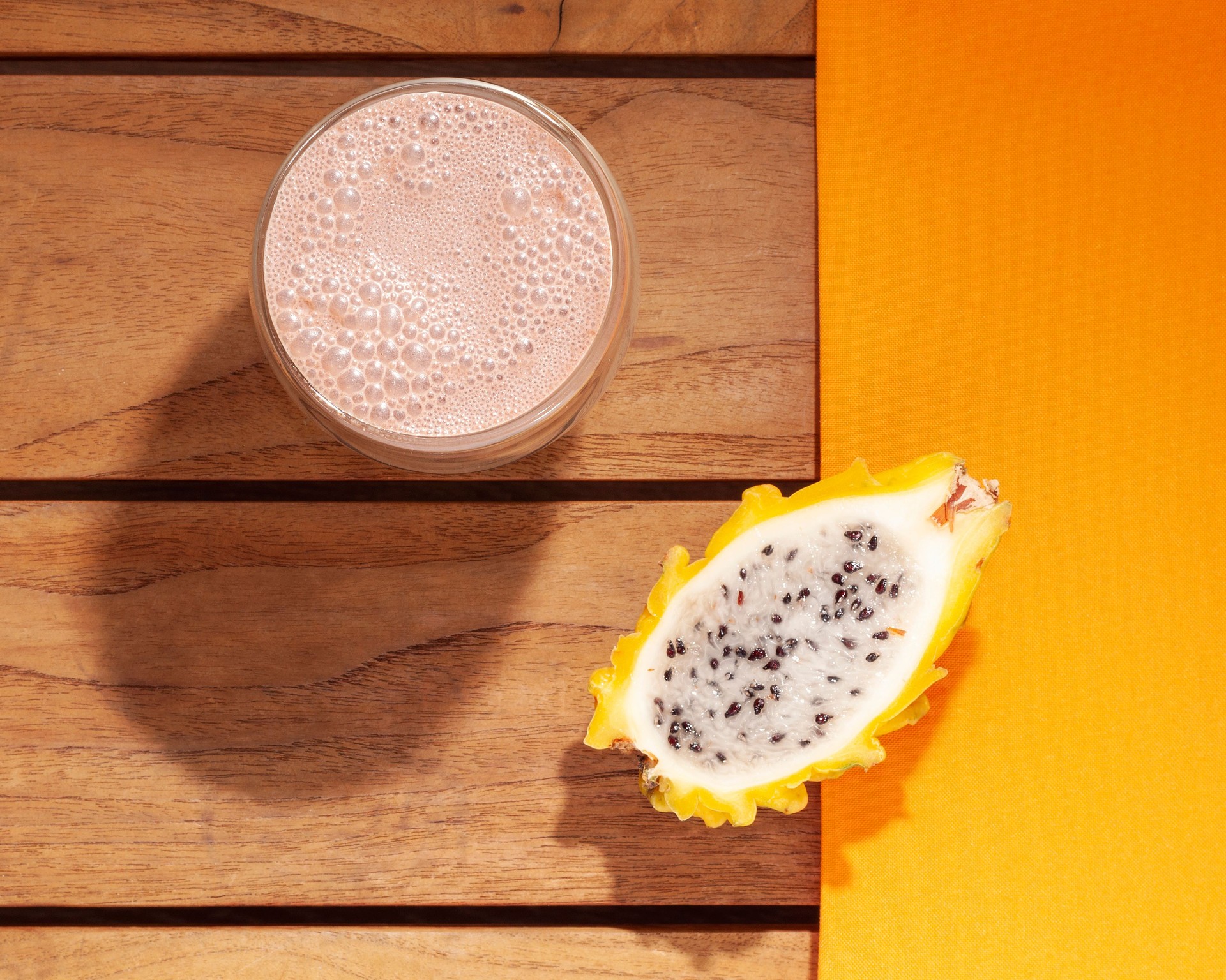 glass of chocolate drink and yellow dragon fruit
